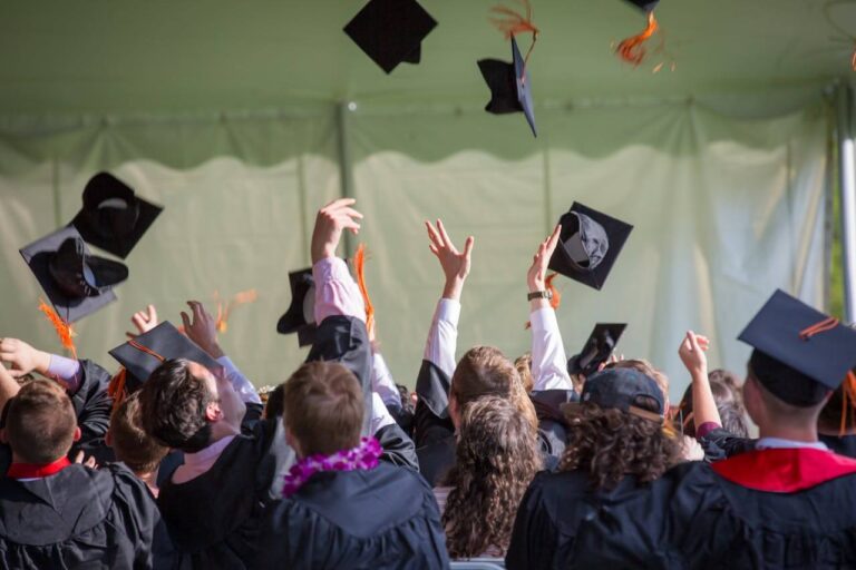 The Best University Courses to Land High‑Paying Jobs in 2025 The best university courses - a photo of university graduates throwing their university caps into the air after graduating.